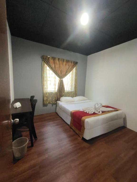 Postel nebo postele na pokoji v ubytování 1 Hati Homestay Sepang