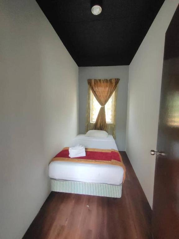 Postel nebo postele na pokoji v ubytování 1 Hati Homestay Sepang
