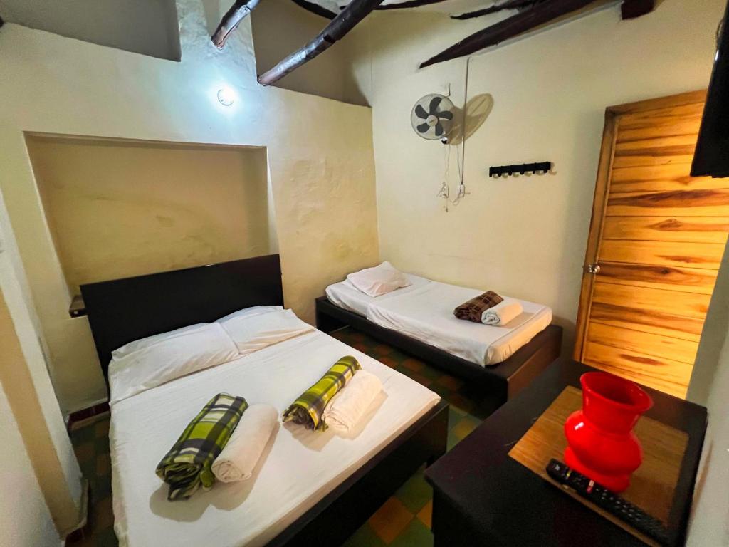 Un pat sau paturi într-o cameră la Hotel Solárium Posada