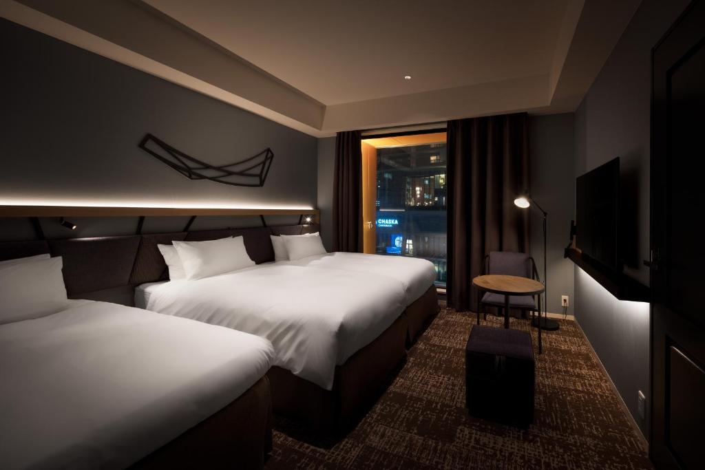 Postel nebo postele na pokoji v ubytování Nest Hotel Osaka Umeda