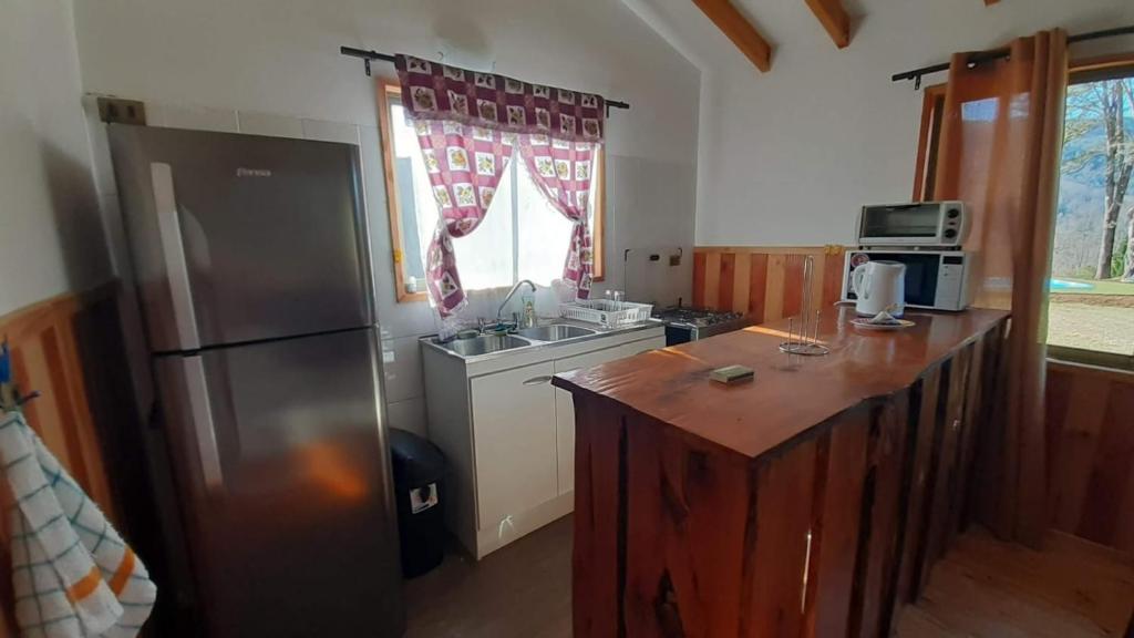 Kuchyň nebo kuchyňský kout v ubytování Cabaña Mirador Caburgua