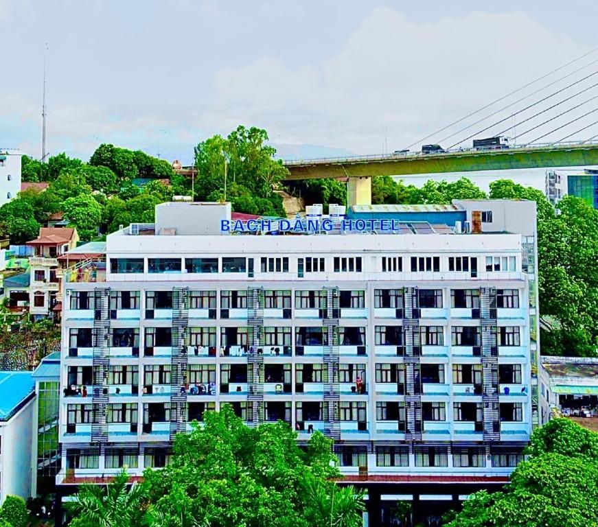 a large white building with a train on top of it at Bạch Đằng Hạ Long Hotel in Ha Long