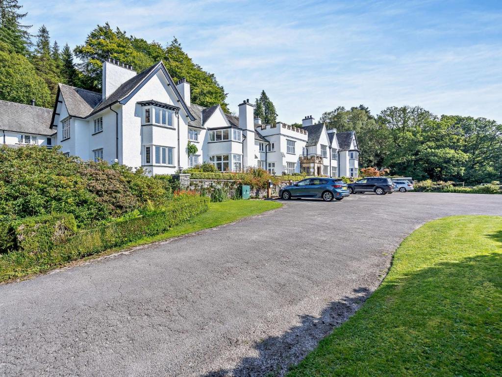 a row of houses on the side of a road at 3 Bed in Hawkshead 88985 in Near Sawrey