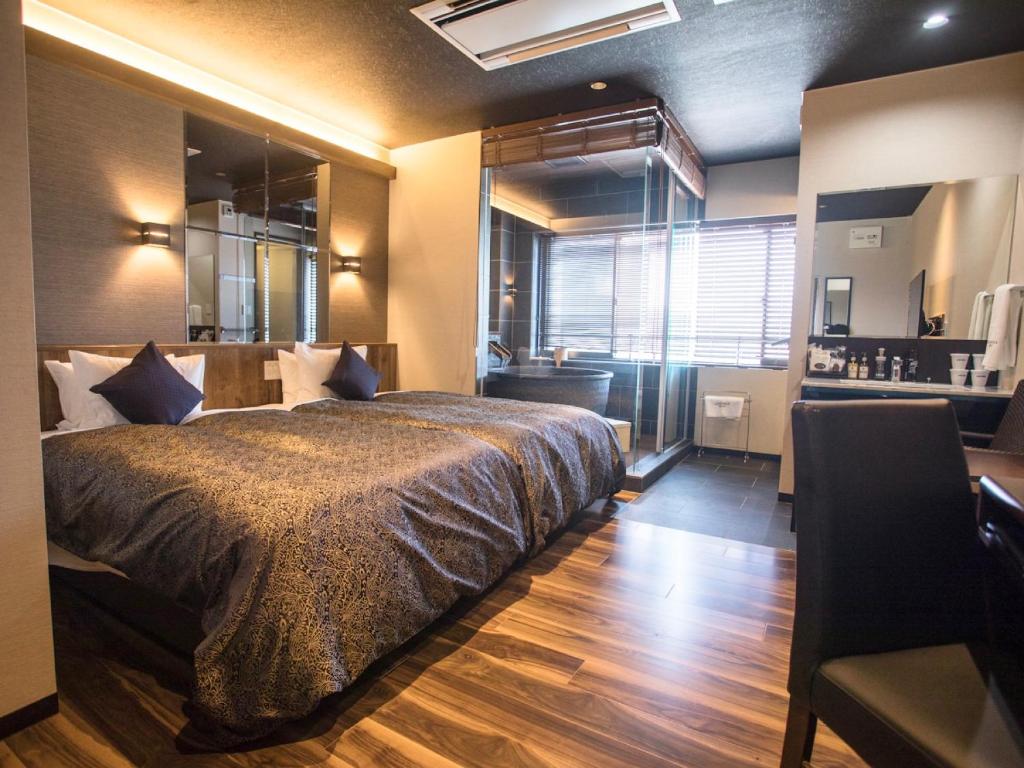 Postel nebo postele na pokoji v ubytování LiVEMAX RESORT Kyotango Sea Front
