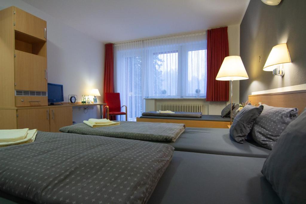 Postel nebo postele na pokoji v ubytování Green Night Hotel