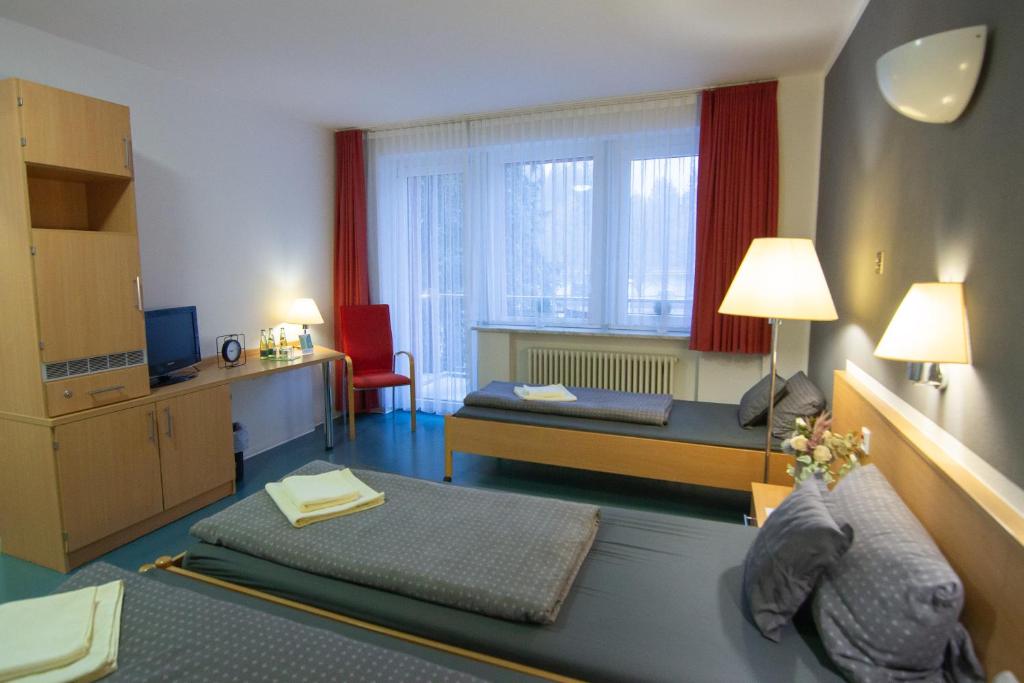 Postel nebo postele na pokoji v ubytování Green Night Hotel