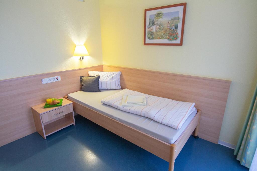 Postel nebo postele na pokoji v ubytování Green Night Hotel