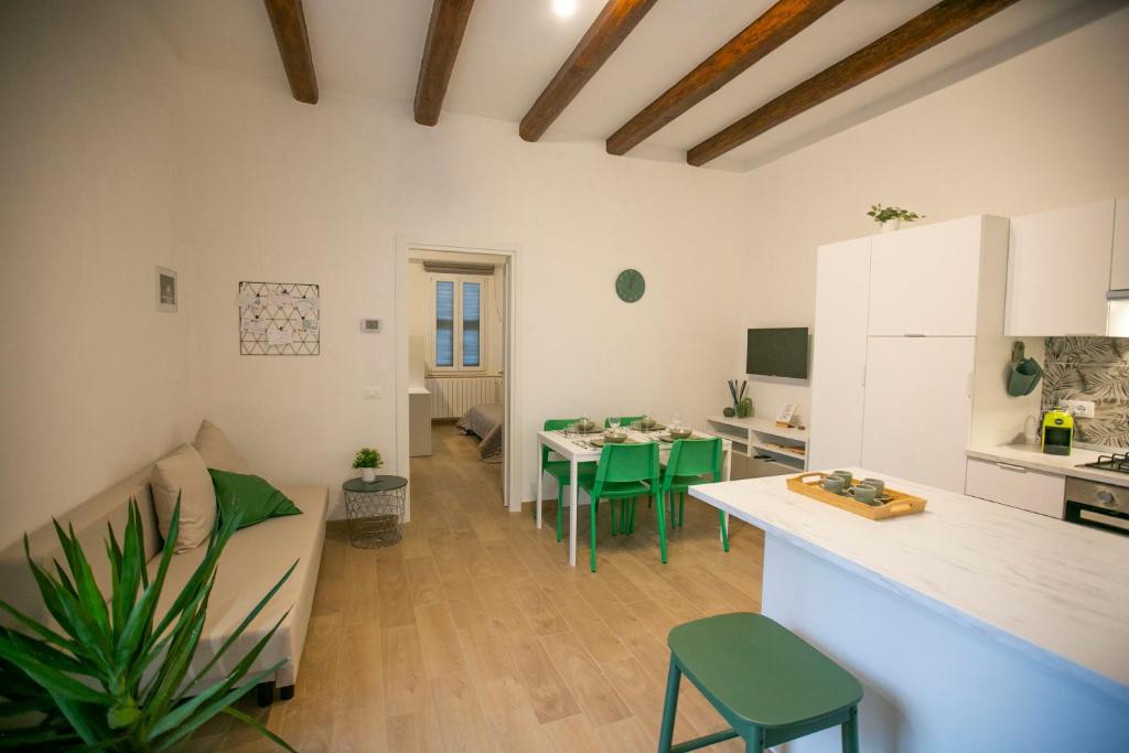 a kitchen and living room with a table and chairs at NonSoloValle in Chiaravalle