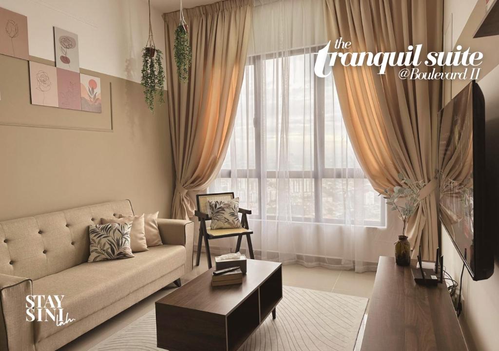 a living room with a couch and a large window at Tranquil Suite, MKH Boulevard 2 in Kajang