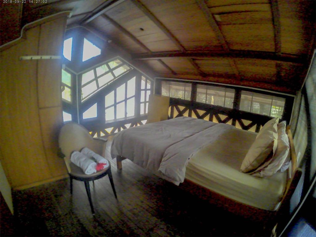 Postel nebo postele na pokoji v ubytování Karang Aji Beach Villa