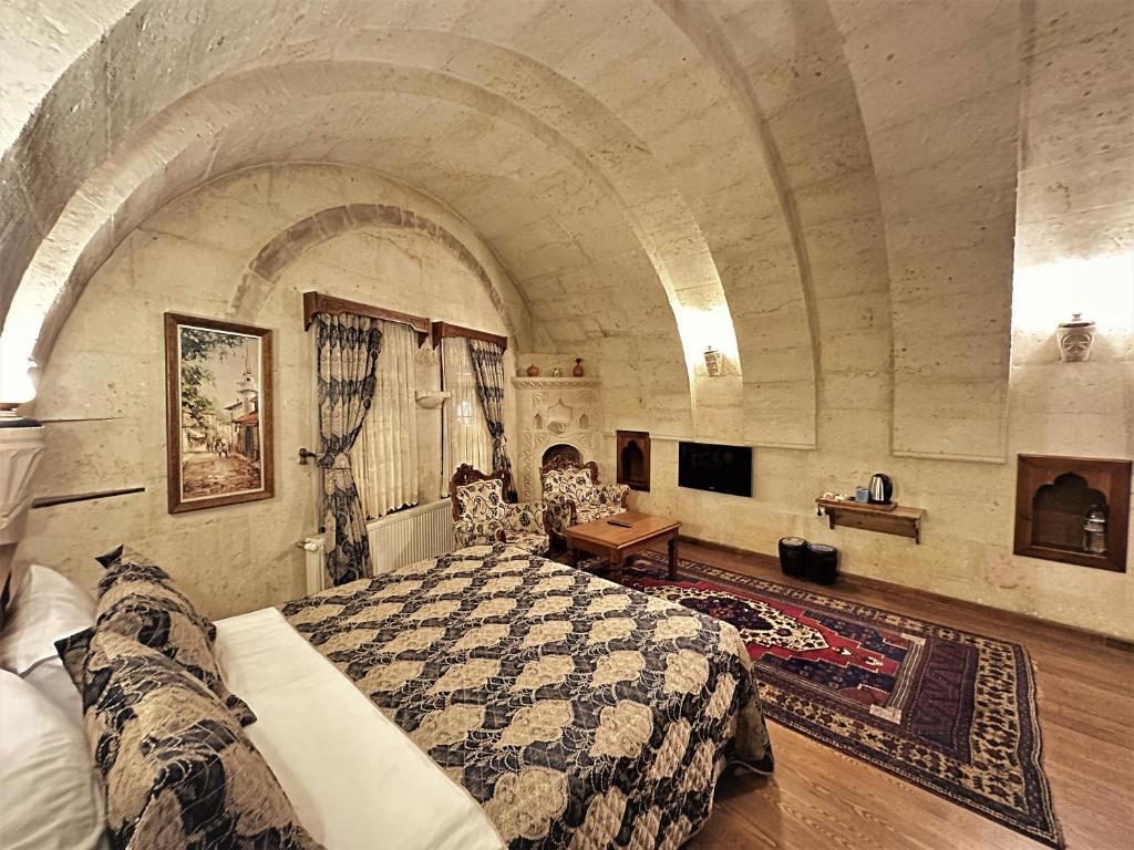 TV a/nebo společenská místnost v ubytování Stone House Cave Hotel