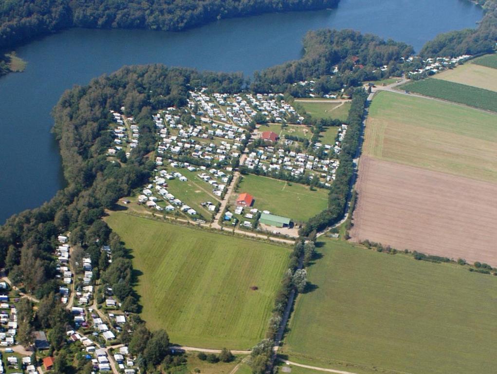 an aerial view of a town next to a lake at Natur-Campingplatz Salemer See in Salem