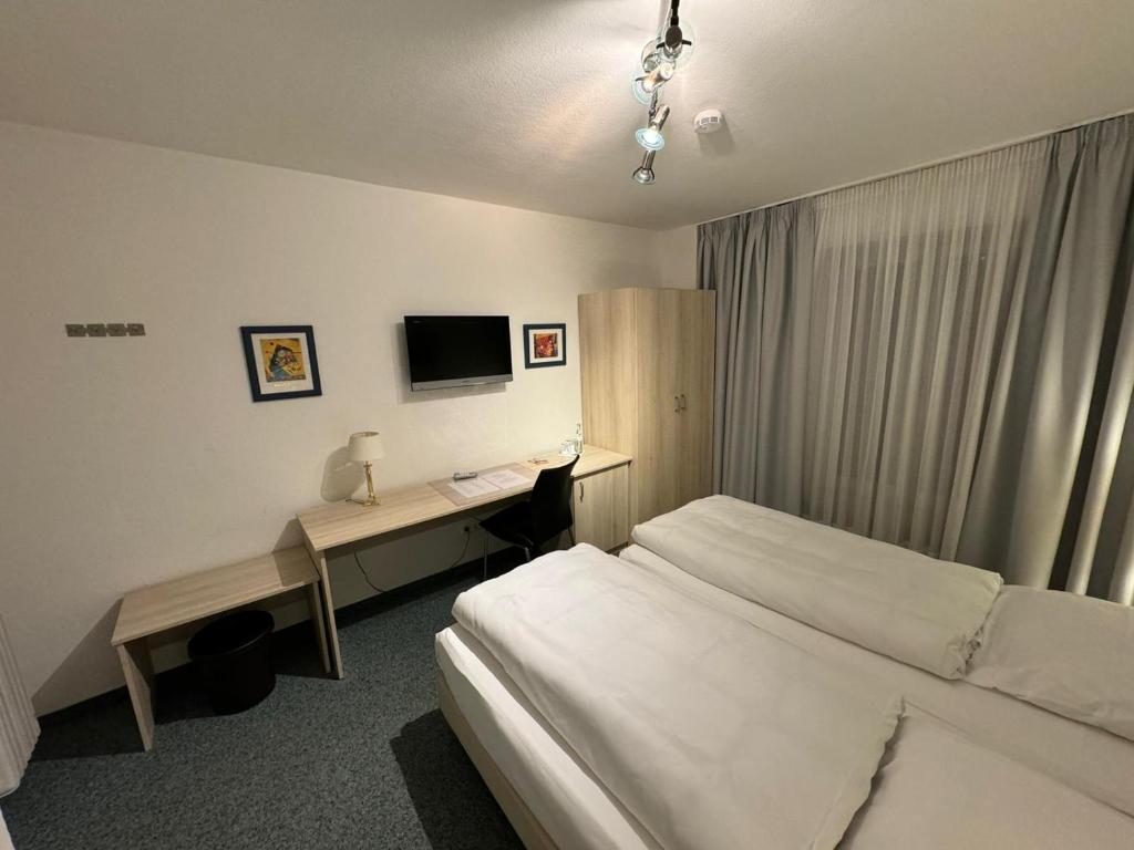 Postel nebo postele na pokoji v ubytování Hotel Occam
