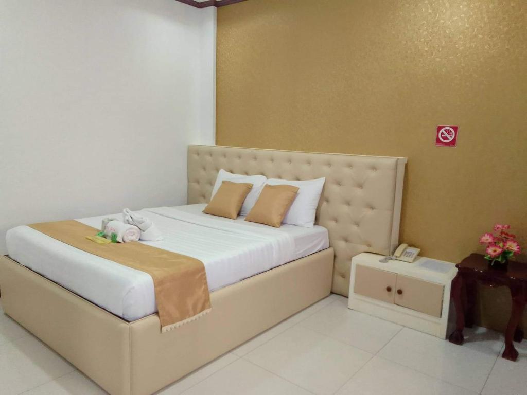 Postel nebo postele na pokoji v ubytování D'Mariners Inn Hotel