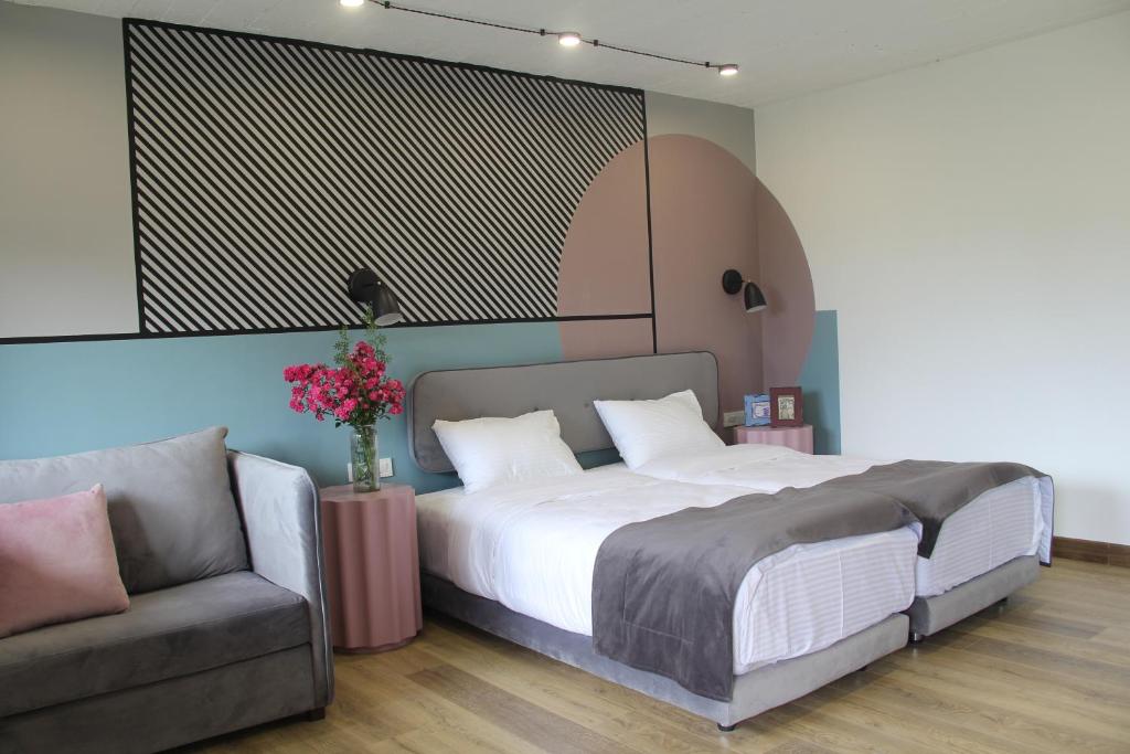 Postel nebo postele na pokoji v ubytování Hover Boutique Hotel