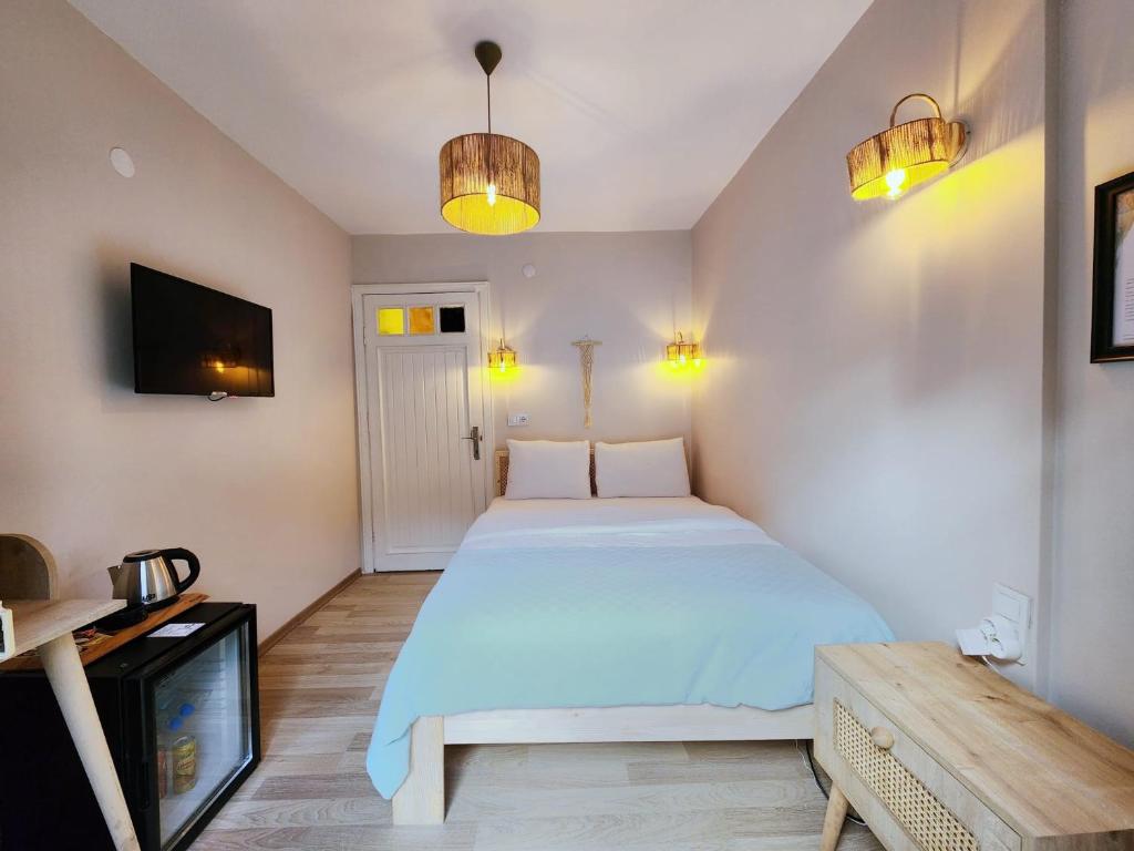 Postel nebo postele na pokoji v ubytování Aya Butik Otel