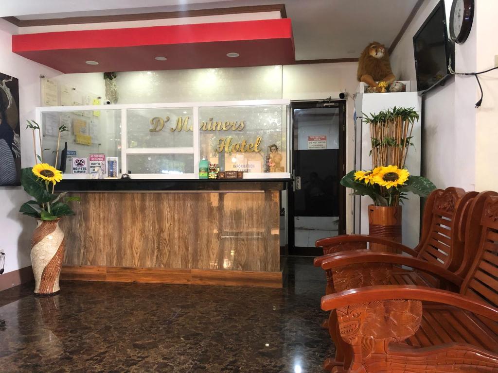 TV a/nebo společenská místnost v ubytování D'Mariners Inn Hotel