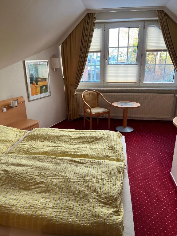 Postel nebo postele na pokoji v ubytování Gästehaus Janßen