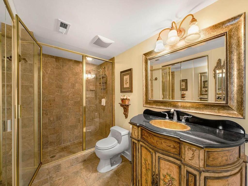 a bathroom with a sink and a toilet and a shower at Arcadian Getaway - Oceanfront Condo, With Pool and Wifi, Monthly Winter Rental in Myrtle Beach