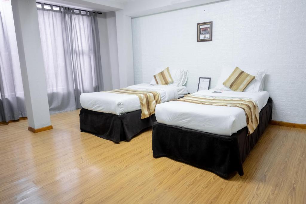 Postel nebo postele na pokoji v ubytování Nyadha House Bed & Breakfast