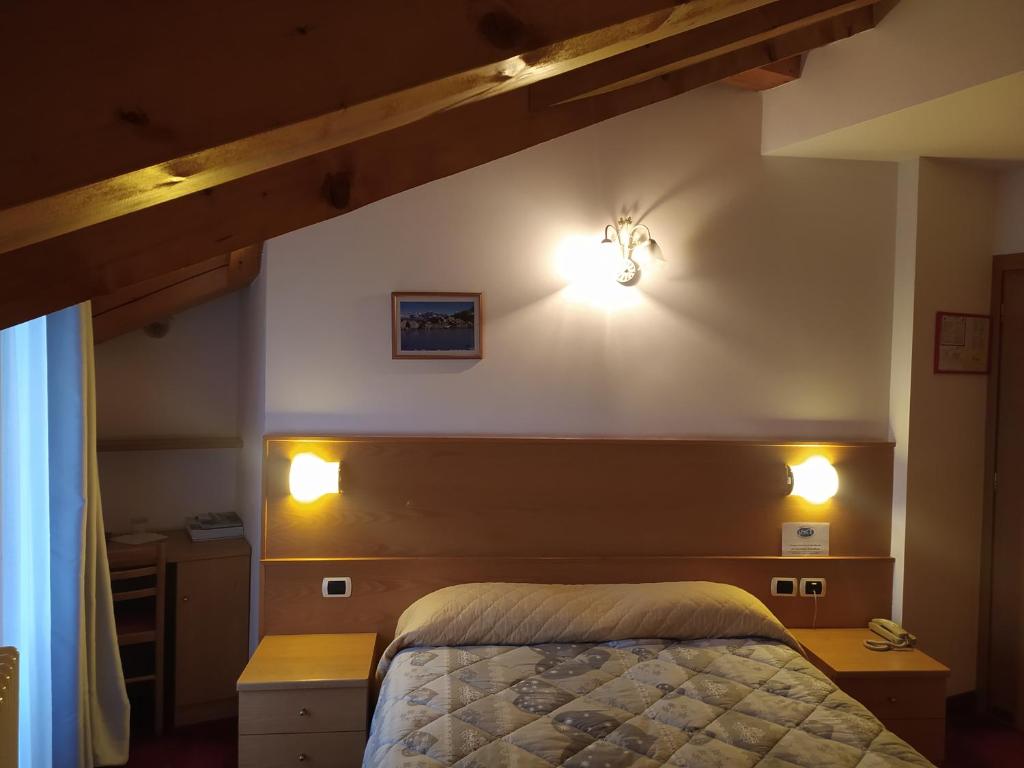 Postel nebo postele na pokoji v ubytování Hotel Orso Grigio