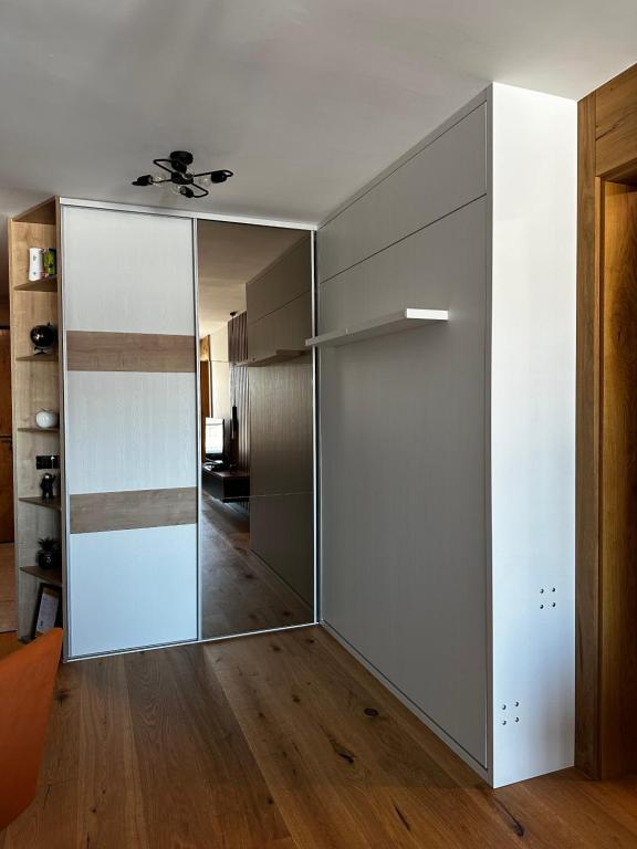 a large sliding glass door in a living room at Apartment Aurora in Bjelašnica