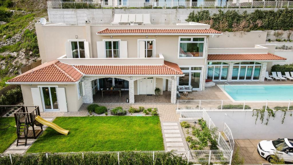 an aerial view of a house with a swimming pool at Vila Natura IV in Opatija