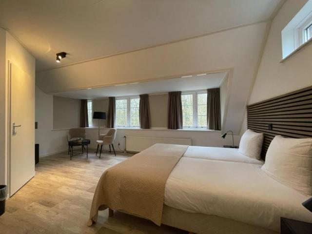 Postel nebo postele na pokoji v ubytování Hotel Randduin