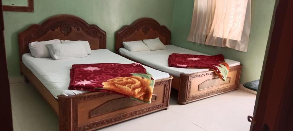 Postel nebo postele na pokoji v ubytování Hotel Raghunath Residency Niwas