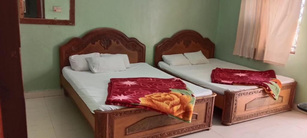 Postel nebo postele na pokoji v ubytování Hotel Raghunath Residency Niwas