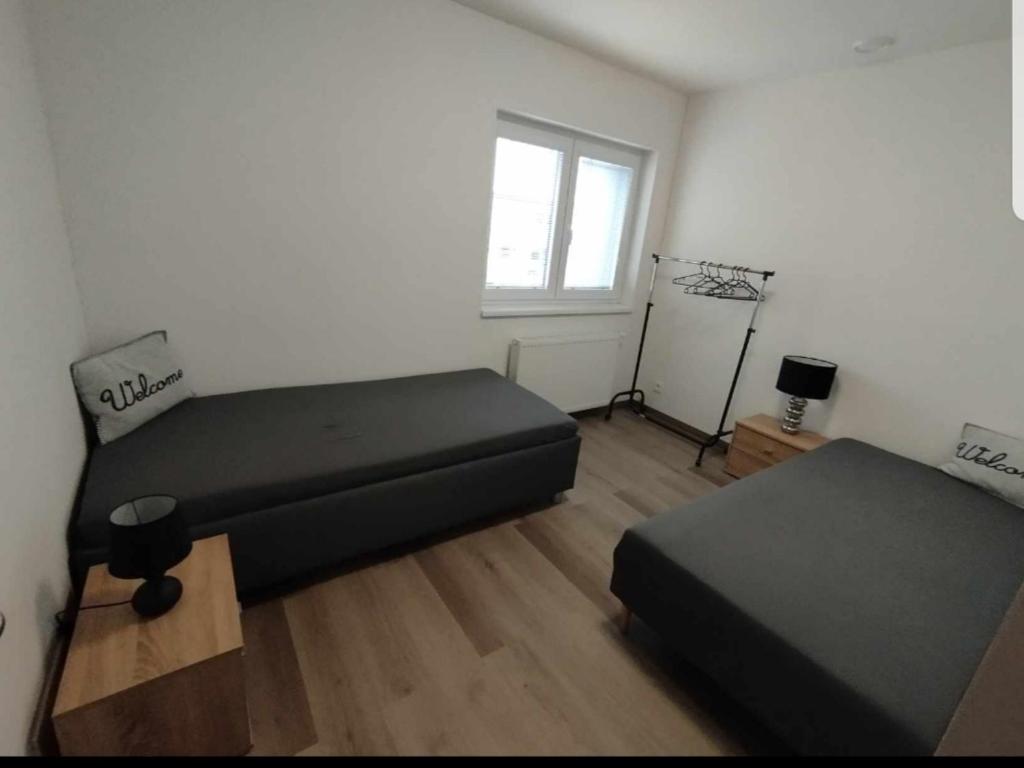 Posteľ alebo postele v izbe v ubytovaní Černá Růže- Apartmán 5