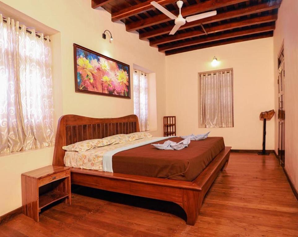 Postel nebo postele na pokoji v ubytování Dhanagiri Homestay Wayanad