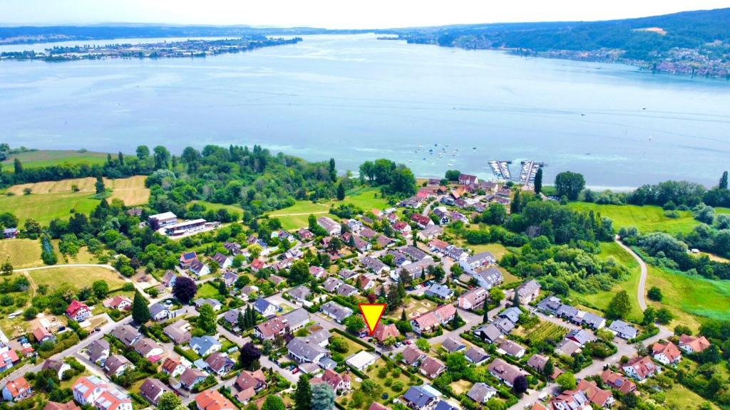 an aerial view of a residential area next to the water at Ferienwohnung Seesprung am Bodensee in Gaienhofen
