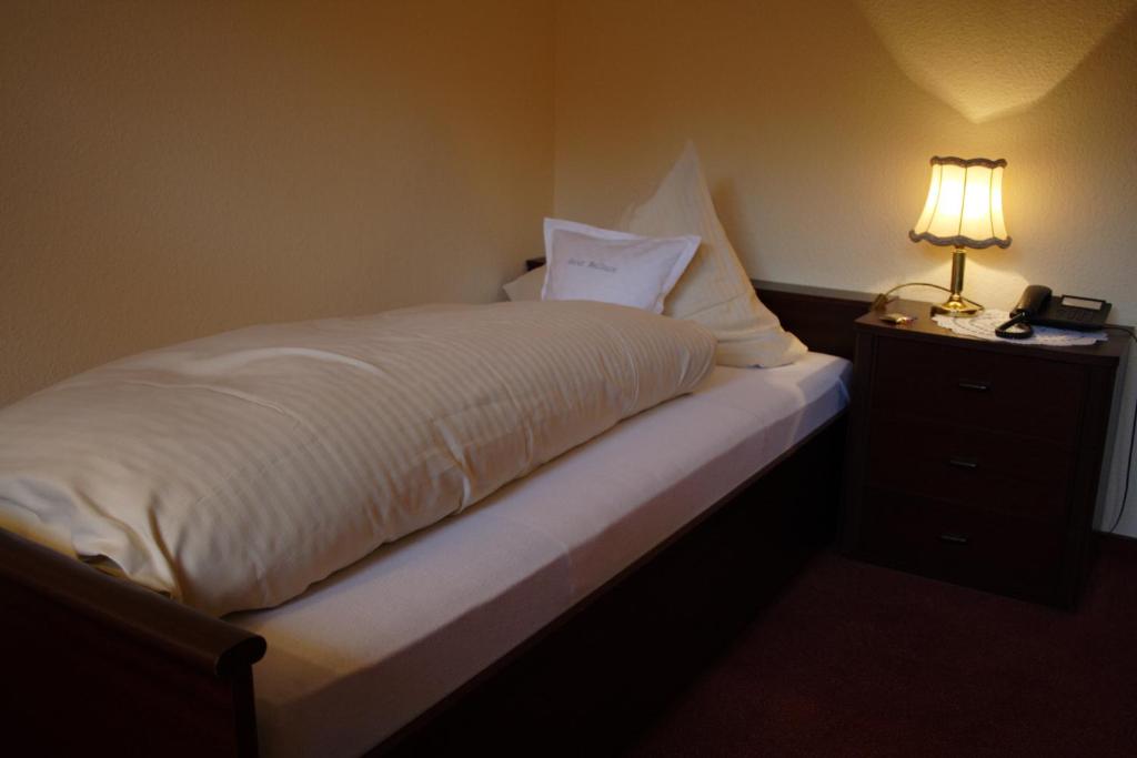 Postel nebo postele na pokoji v ubytování Hotel Graf Balduin