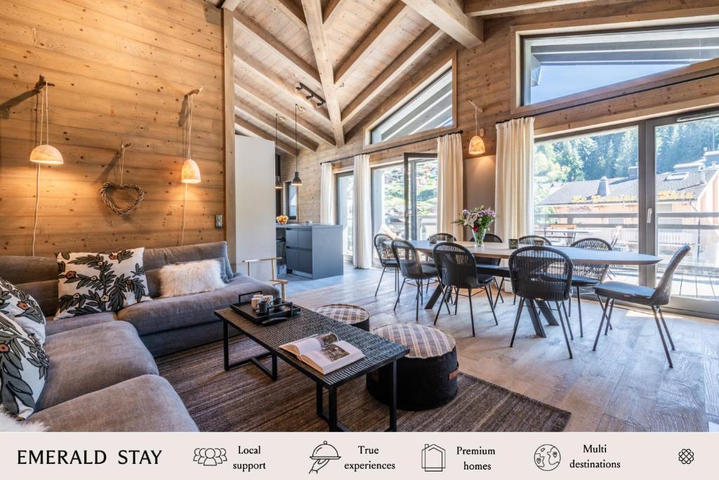 a living room with a couch and a table at Apartment Merbau Les Gets - by EMERALD STAY in Les Gets