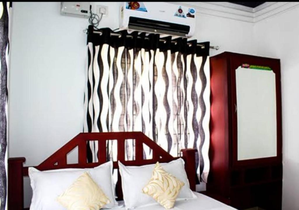 Bekal Fort Resorts BFR tesisinde bir odada yatak veya yataklar