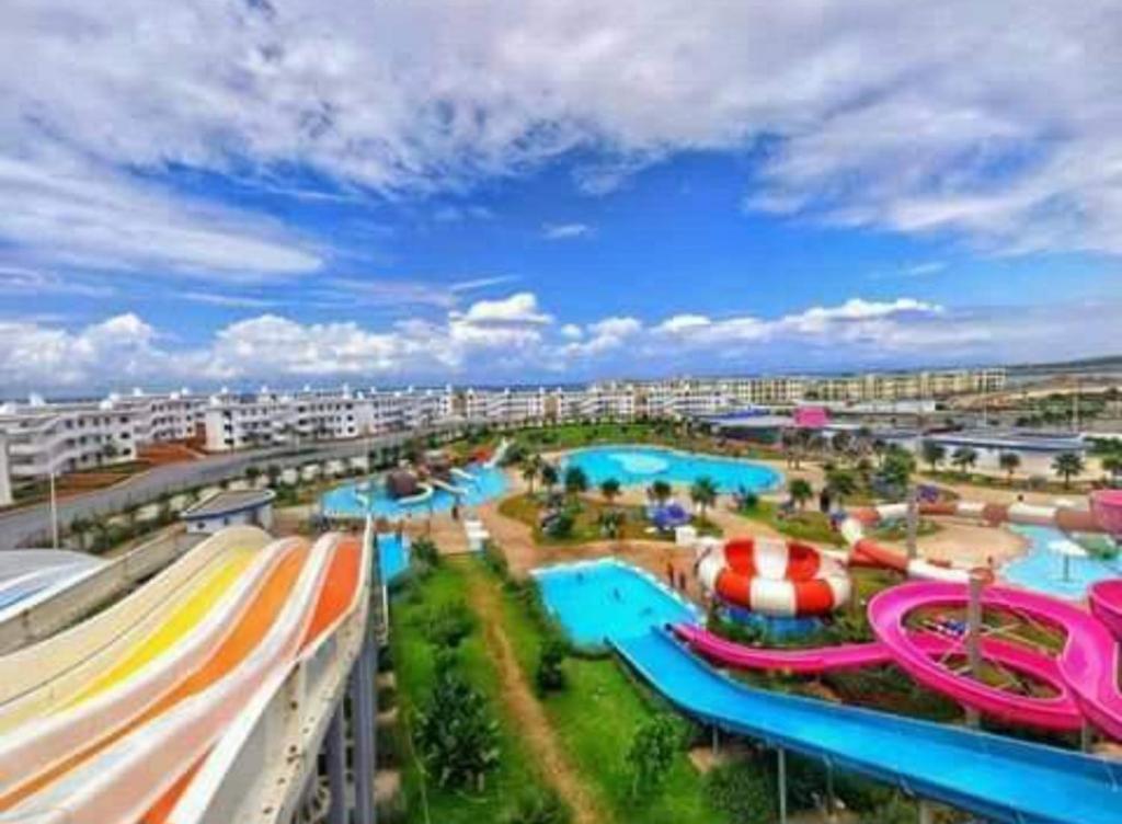 an amusement park with a water park with slides at MEHDIA PLAYA in Kenitra