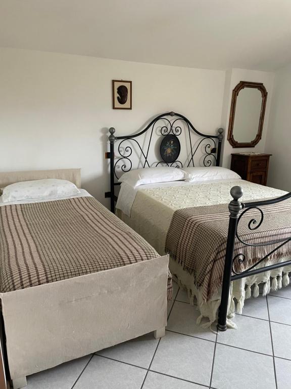 מיטה או מיטות בחדר ב-Pian della Battaglia