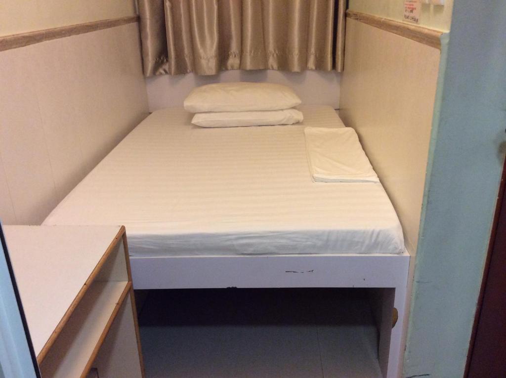 Voodi või voodid majutusasutuse Li Cheng Guesthouse toas
