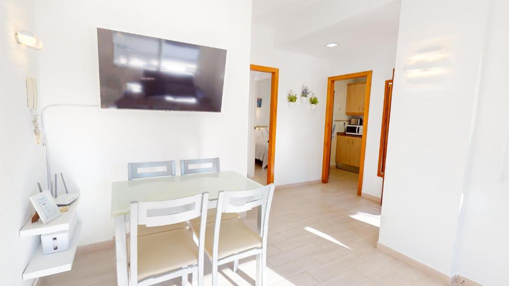 Televízia a/alebo spoločenská miestnosť v ubytovaní Apartamento Nueva Vida by Family Homes