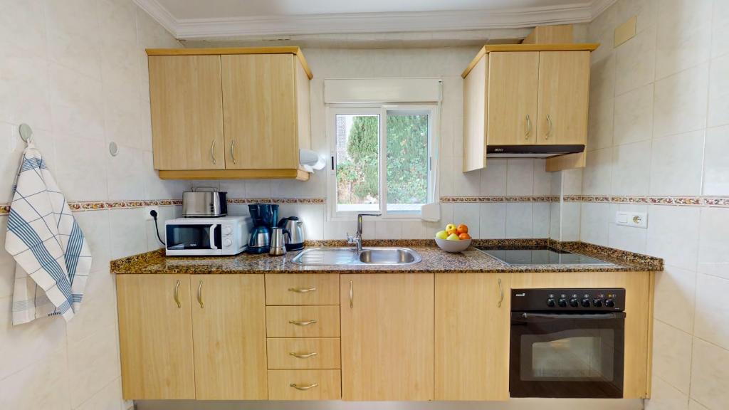 Kuchyňa alebo kuchynka v ubytovaní Apartamento Nueva Vida by Family Homes