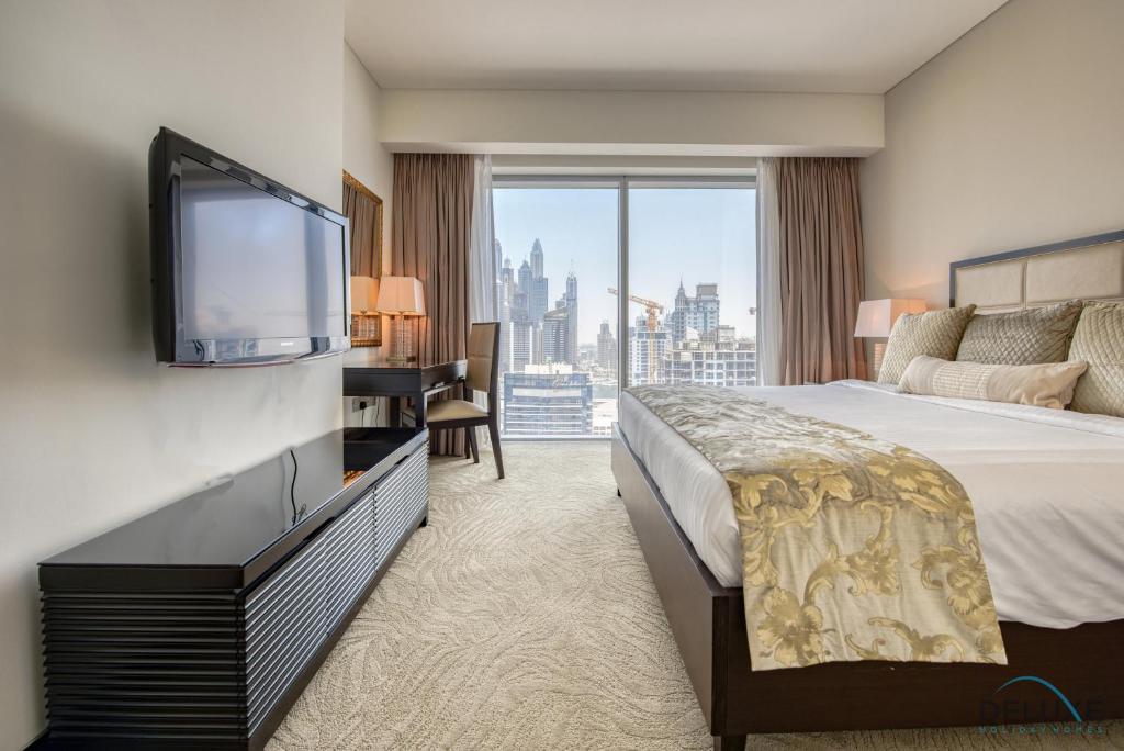 Postel nebo postele na pokoji v ubytování Posh 1BR at The Address Residences Dubai Marina by Deluxe Holiday Homes