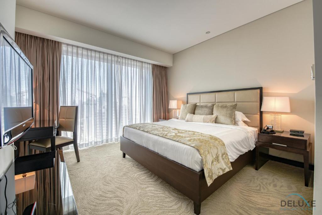 Postel nebo postele na pokoji v ubytování Posh 1BR at The Address Residences Dubai Marina by Deluxe Holiday Homes