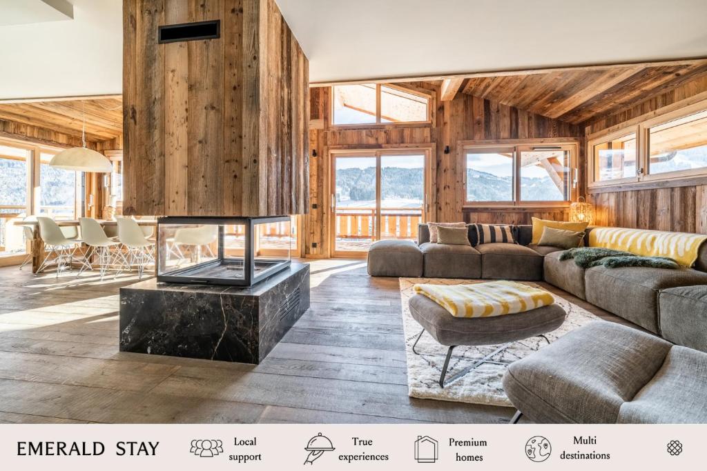 a living room with a couch and a table at Chalet Floquet de Neu Les Gets- BY EMERALD STAY in Les Gets