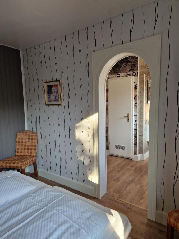 Postel nebo postele na pokoji v ubytování Harz Hotel Waldhaus