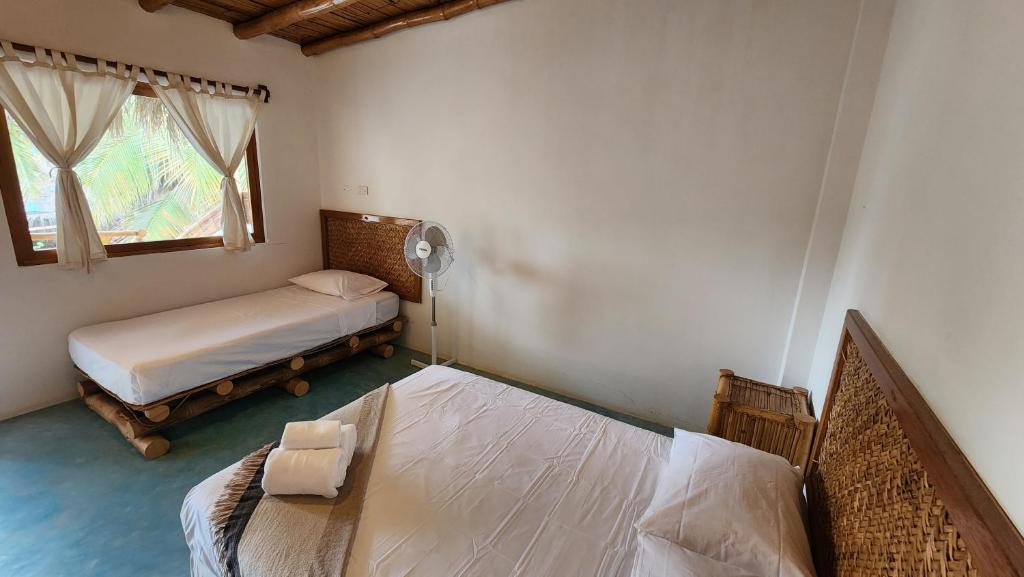 Postel nebo postele na pokoji v ubytování Kinti Guest House