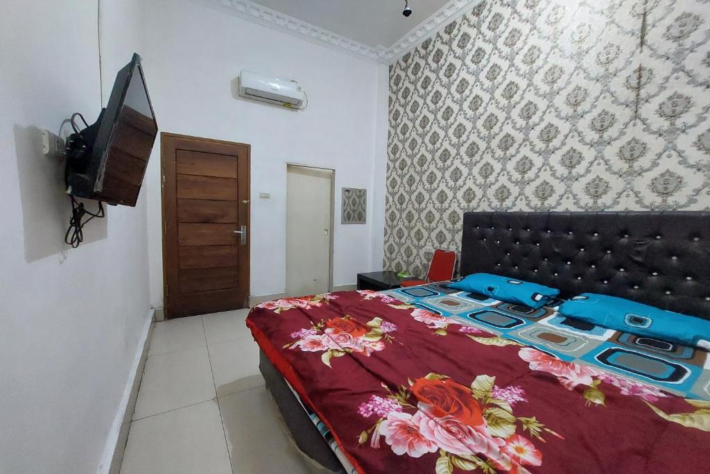Postel nebo postele na pokoji v ubytování Hotel Mulia Tiza