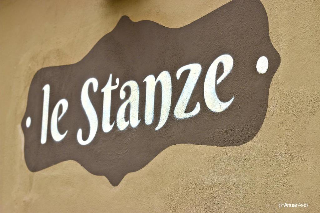 a sign that says me stanza on a wall at Le Stanze in Bologna