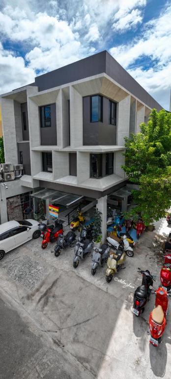 a group of motorcycles parked in front of a building at Kasa Boutique Hotel Kasambagan in Cebu City