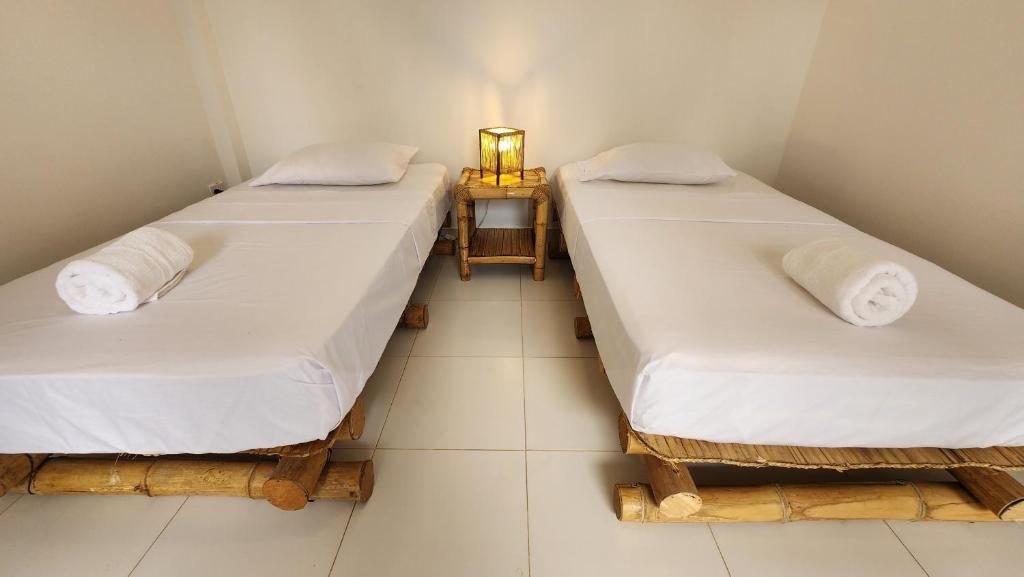 Postel nebo postele na pokoji v ubytování Kinti Guest House